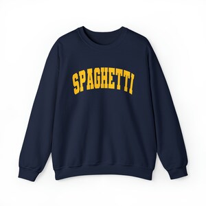 May include: A navy blue sweatshirt with the word "SPAGHETTI" printed in yellow on the front.