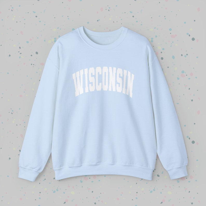 May include: A light blue sweatshirt with the word "WISCONSIN" printed in white on the front.