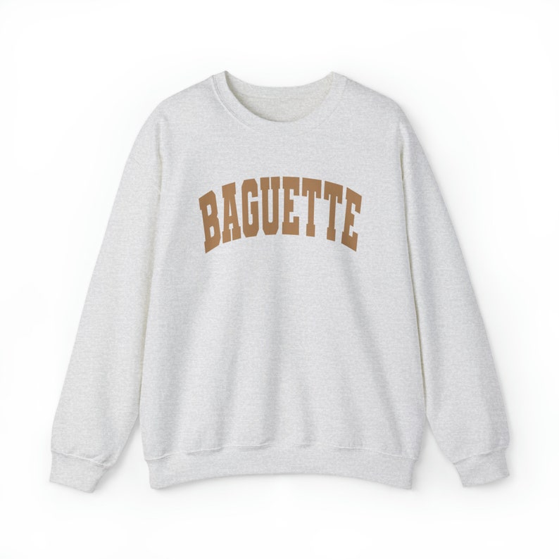 May include: A gray sweatshirt with a brown "BAGUETTE" graphic printed on the front.