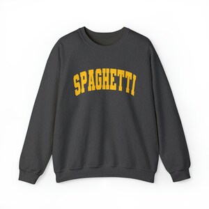 May include: A dark gray sweatshirt with the word "SPAGHETTI" printed in yellow on the front.