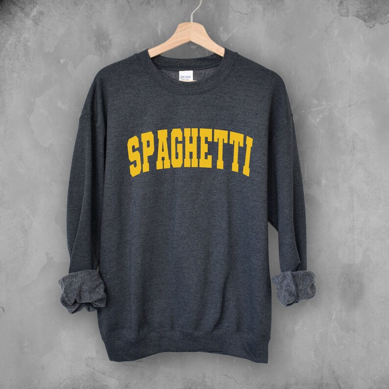 May include: A dark gray sweatshirt with the word "SPAGHETTI" printed in yellow on the front.