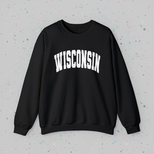 May include: Black sweatshirt with white text that reads "WISCONSIN" in an arched font.