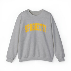 May include: A gray sweatshirt with the word "SPAGHETTI" printed in yellow on the front.