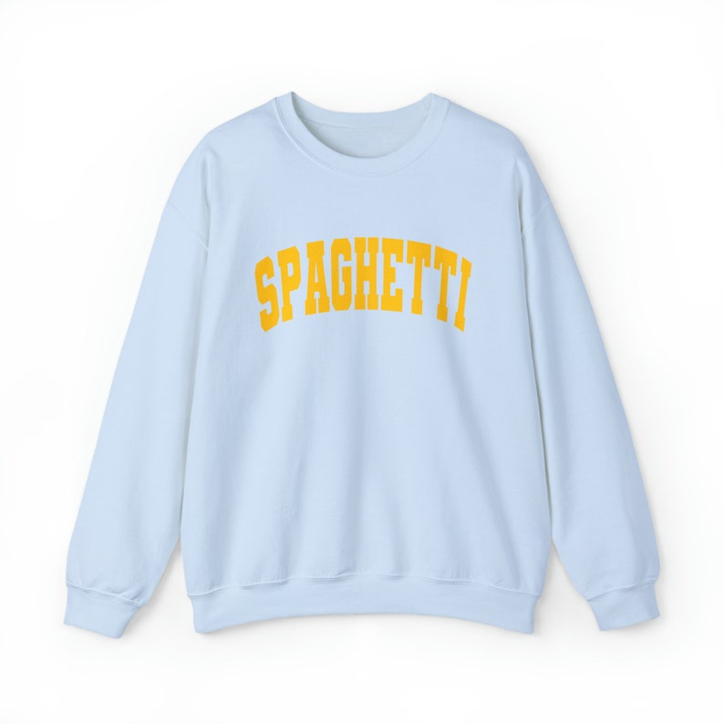 May include: Light blue sweatshirt with the word "SPAGHETTI" printed in yellow.