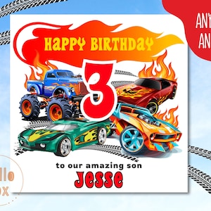 May include: A birthday card with a red, orange and yellow flame design. The card features a monster truck, a red sports car and a yellow sports car. The number 3 is in the centre of the card in red. The text "Happy Birthday" is in yellow and red. The text "to our amazing son Jesse" is at the bottom of the card.
