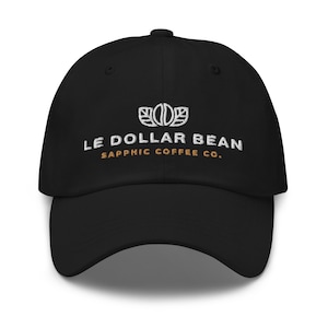 May include: Black baseball cap with white embroidery of a coffee bean logo and the text "LE DOLLAR BEAN SAPPHIC COFFEE CO."
