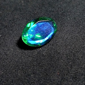 Faceted Peacock Quartz Gemstone: Oval Cabochon, Blue Fire (9x13mm)