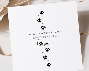 May include: A white card with black paw prints and red hearts. The card reads "To a pawsome mum happy birthday I love you".