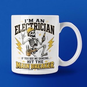 May include: A white ceramic mug featuring a graphic of a skeleton wearing a yellow hard hat, holding a screwdriver, and wearing a tool belt. The text reads I'M AN ELECTRICIAN IF YOU SEE ME DANCING... HIT THE MAIN BREAKER with yellow lightning bolts.