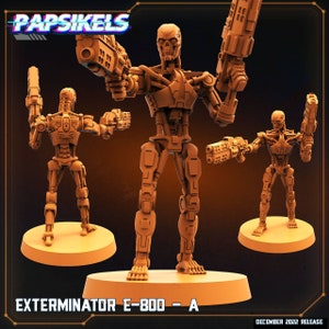 May include: Three brown Exterminator E-800 - A robot figurines with guns, standing on round bases. The central figure is the largest, with two smaller figures on either side. The text "PAPSIKELS" is at the top, and "EXTERMINATOR E-800 - A" is at the bottom.