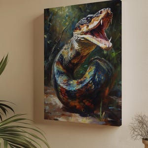 May include: A rectangular canvas wall art print featuring an oil painting of a coiled snake with its mouth wide open, revealing sharp fangs. The snake displays a vibrant, multi-coloured scale pattern in shades of blue, orange, and yellow.