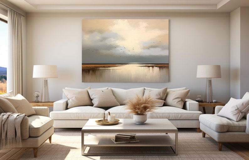 May include: A living room interior with a white sofa, two armchairs, a coffee table, and a large abstract painting of a seascape with birds flying over a body of water.