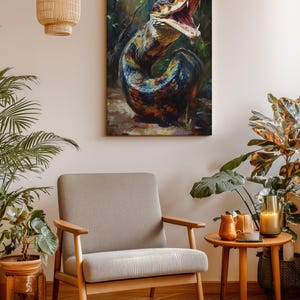 May include: A rectangular wall art print featuring a vibrant, painterly depiction of a coiled snake with its mouth open, displaying sharp teeth. The snake has iridescent scales in shades of blue, green, orange, and black, set against a dark, forest-like background.
