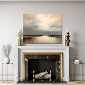 May include: A painting depicting a seascape with a golden sky and a flock of birds flying over a body of water. The painting is framed and hangs above a fireplace.