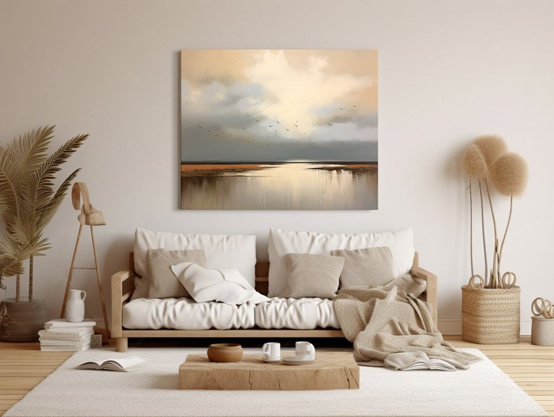 May include: A painting depicting a seascape with a golden sky and a flock of birds flying over a body of water. The water reflects the light of the sky, creating a shimmering effect.