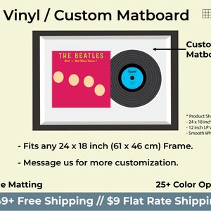 May include: A framed 12-inch vinyl record with a custom matboard. The record is black with a blue label that says "Capitol". The album cover is red with the text "THE BEATLES" and "Rock 'n' Roll Music Volume 1". The frame is black with a white matboard. The matboard is available in 25+ colors.
