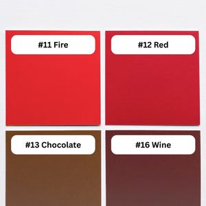 May include: A color swatch chart featuring four square samples labeled #11 Fire in bright red, #12 Red in a deeper shade, #13 Chocolate in brown, and #16 Wine in dark maroon, with a top label #00 Cotton White indicating the background color.