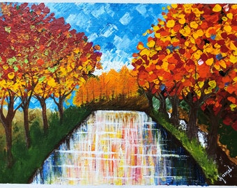 May include: A painting of a stream with trees on either side. The trees have red, orange, and yellow leaves. The stream is reflecting the colors of the trees.