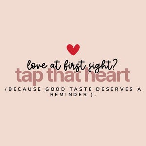 May include: A light pink graphic featuring a small red heart icon above the black cursive text "love at first sight?" and the bold, dark pink text "tap that heart" followed by the parenthetical text "(BECAUSE GOOD TASTE DESERVES A REMINDER)."
