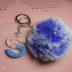 Resin S letter keychain with puff ball in blue