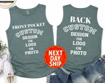 May include: Two slate blue tank tops featuring white text. The left tank top displays FRONT/POCKET CUSTOM DESIGN OR LOGO OR PHOTO. The right tank top displays BACK CUSTOM DESIGN OR LOGO OR PHOTO. A Comfort Colors logo and a Next Day Ship badge are visible.