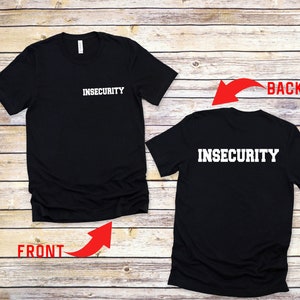 May include: Black t-shirt with the word "INSECURITY" printed in white on the front and back.