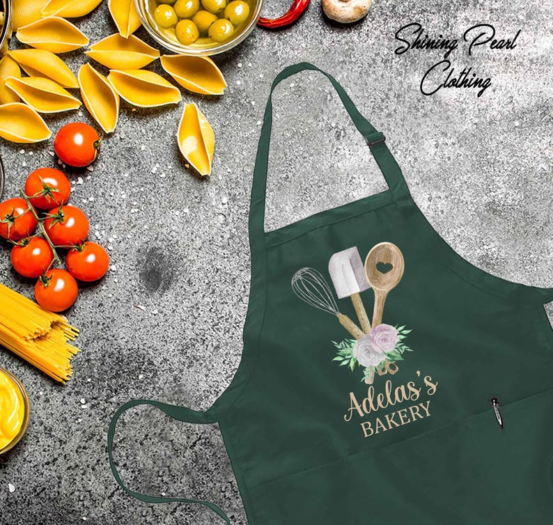 a green apron with the words adams's bakery on it