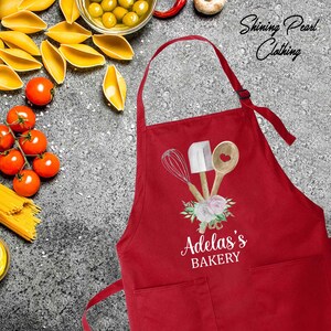 a red apron with the words add's bakery on it