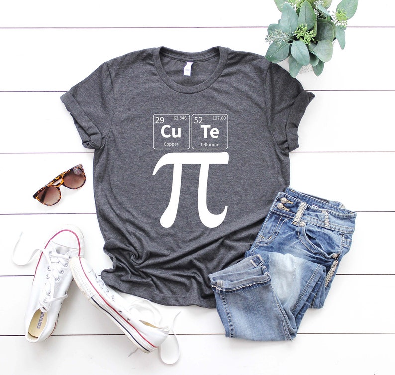 May include: A dark gray t-shirt with a white graphic of the mathematical symbol pi and the chemical symbols for copper and tellurium, which spell out "CuTe".