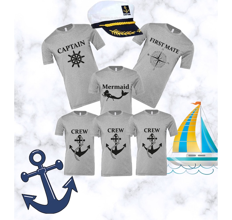 May include: A set of five grey t-shirts with nautical themed designs. The shirts feature a captain's hat, a compass, a mermaid, and an anchor. The shirts are perfect for a family vacation or a themed party.