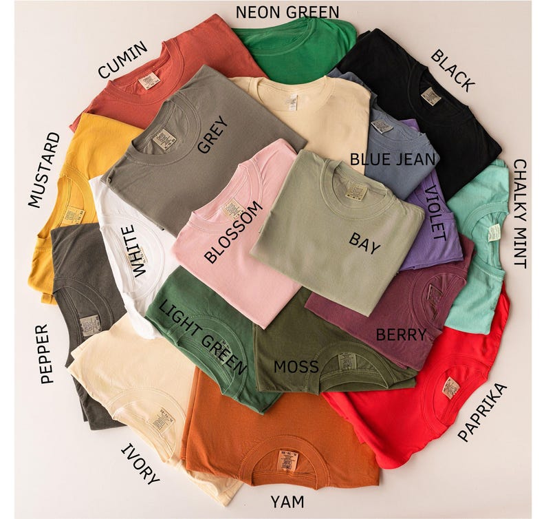 a bunch of shirts that are on a table