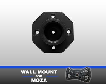 May include: A black octagonal wall mount for a Moza racing steering wheel. The mount features a central circular opening and four pre-drilled screw holes. The text "WALL MOUNT FOR MOZA" is printed below, alongside a small image of a racing wheel.