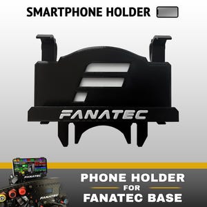 Może przedstawiać: Czarny uchwyt na smartfona do podstawy Fanatec, z logo Fanatec w białym tekście i wycięciem w kształcie stylizowanej litery F. Urządzenie posiada górne klipsy oraz dolny wspornik montażowy do przymocowania do podstawy kierownicy wyścigowej.