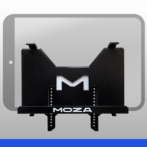 May include: A black metal tablet mount featuring a central cutout letter M and the white text MOZA printed on the front ledge. The device includes adjustable vertical brackets with multiple circular holes for positioning and a flat support base.