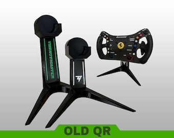 May include: Two black tripod stands for gaming equipment, one featuring green Thrustmaster branding and the other a white TM logo. A black Ferrari racing steering wheel with colorful buttons and a carbon fiber texture is mounted on a third matching stand.