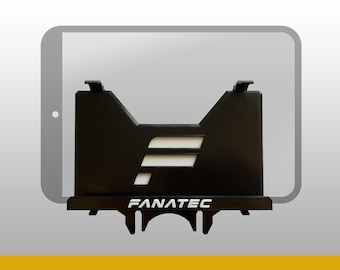 May include: A black plastic tablet mount featuring the Fanatec logo in white text on the front base and a stylized white F cutout on the main panel. The mount is designed to hold a tablet, which is represented by a gray outline behind the holder.