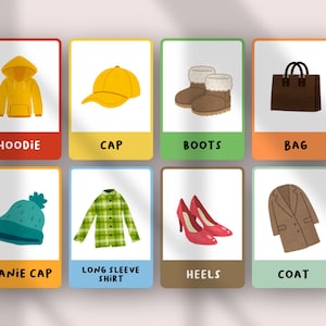 May include: A set of eight educational flashcards featuring illustrations of clothing and accessories: a yellow hoodie, yellow cap, brown boots, brown bag, teal beanie cap, green plaid long sleeve shirt, red heels, and a brown coat.