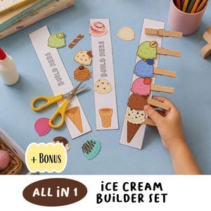 May include: An ice cream builder set featuring paper strips with the text BUILD HERE, various printed ice cream scoop cutouts, a waffle cone, yellow scissors, and wooden clothespins. The set includes a bonus label and the text ALL IN 1 ICE CREAM BUILDER SET.