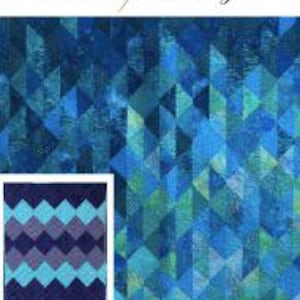 May include: A quilt pattern with the text "Quilted Heartz" and "Ocean Wave". The quilt pattern is a geometric design in shades of blue and green. The dimensions are 152cm x 185cm. An optional pattern variation is shown in a smaller image.
