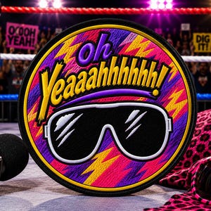 May include: A circular embroidered patch featuring the text Oh Yeaaahhhhh! in yellow and purple lettering above a pair of white-rimmed black sunglasses. The background consists of a vibrant pattern of pink, purple, and yellow lightning bolts.