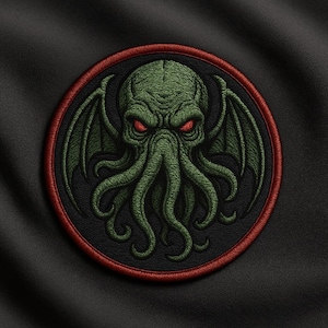 May include: Embroidered patch featuring a green Cthulhu design with red eyes and wings, set against a black background. The patch is circular, with a black center and a red border. The design includes tentacles and a detailed, textured appearance.