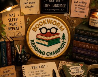 May include: A cozy scene featuring a "Bookworm Reading Champion" patch with glasses and books. Surrounding it are books, a TBR list, a candle, and notes with phrases like "Eat Sleep Read Repeat" and "Books are my love language."