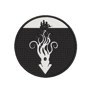 May include: A circular embroidered patch featuring a black and white design. The upper section shows a small ship silhouette on a white horizon, while the lower section depicts a large white kraken or squid with tentacles extending upward.