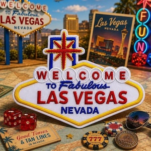 May include: A white, diamond-shaped embroidered patch featuring the text Welcome to Fabulous Las Vegas Nevada in red and blue lettering, topped with a red and blue starburst design, with a yellow border, presented as a decorative souvenir item.