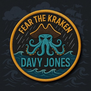 May include: Embroidered patch with a pirate theme. The patch features a blue octopus wearing a brown pirate hat, with the words "FEAR THE KRAKEN" and "DAVY JONES" in gold and blue lettering. The background is black with a yellow border.