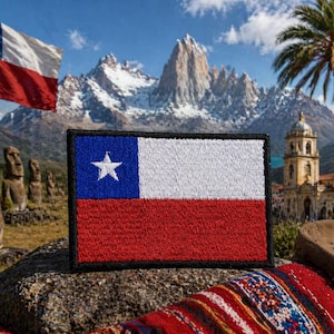 May include: Embroidered patch featuring the flag of Chile, with a blue square and white star in the upper left corner, white stripe, and red stripe. The patch is set against a scenic background of mountains, statues, and a waving Chilean flag.