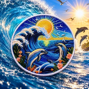 May include: A circular embroidered patch featuring a vibrant ocean scene with two dolphins swimming in deep blue water. A large, cresting wave rises on the left, while a bright yellow sun shines in the background. Pink coral accents the foreground.