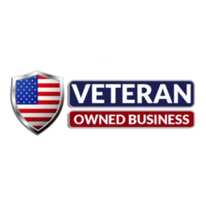 May include: A shield-shaped emblem featuring the American flag with a metallic silver border, positioned to the left of two stacked rectangular banners. The top banner is dark blue with the white text VETERAN, and the bottom is red with white text.