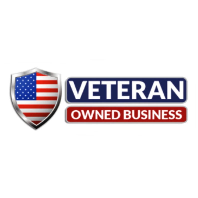 May include: A graphic logo featuring a metallic shield containing the United States flag on the left. To the right, two stacked rectangular banners display the white text VETERAN on a dark blue background and OWNED BUSINESS on a red background.