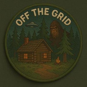 May include: Embroidered patch with the text "OFF THE GRID" above a cabin scene. The scene includes a cabin, trees, a campfire, a UFO, and a Bigfoot figure. The patch is circular with a green border.